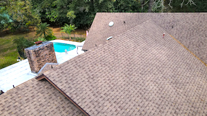 Close roof view of home, pool, chimney