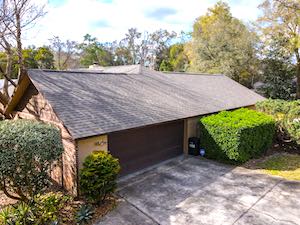 Drone roof level of garage, shrubs