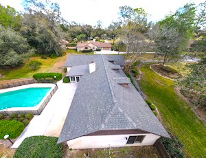 Drone view of home, pool