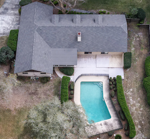 Drone view of home, pool